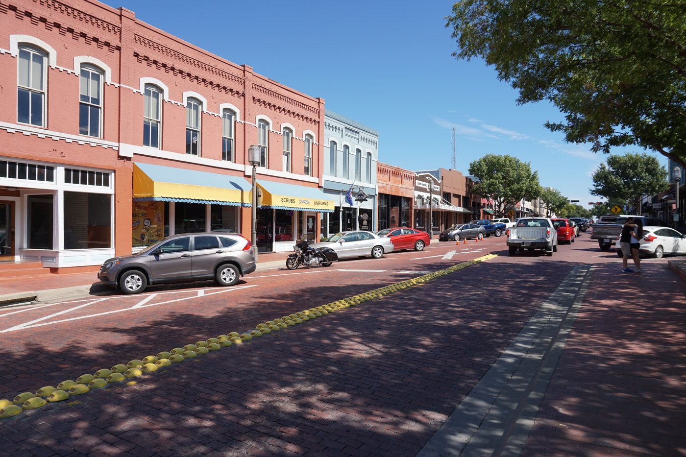 Brick storefronts along 15th Street in Historic Downtown Plano.