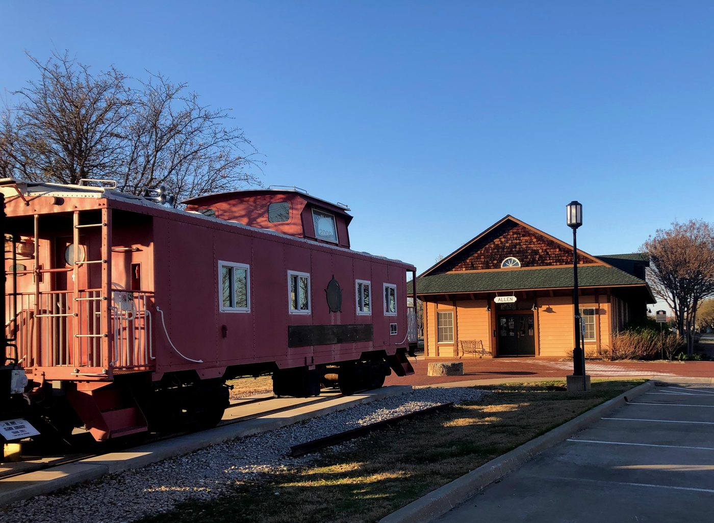 The Village Express caboose and depot at the Allen Heritage Center.