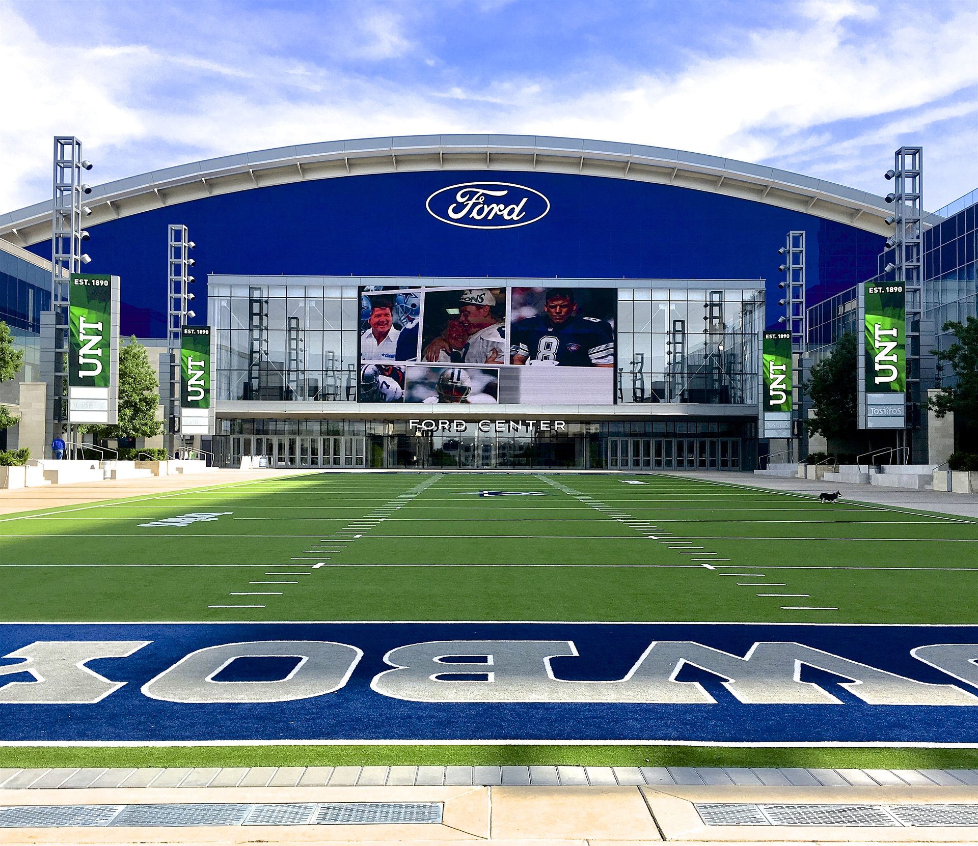 Ford Center at The Star in Frisco, with its outdoor plaza field in front of the stadium entrance.