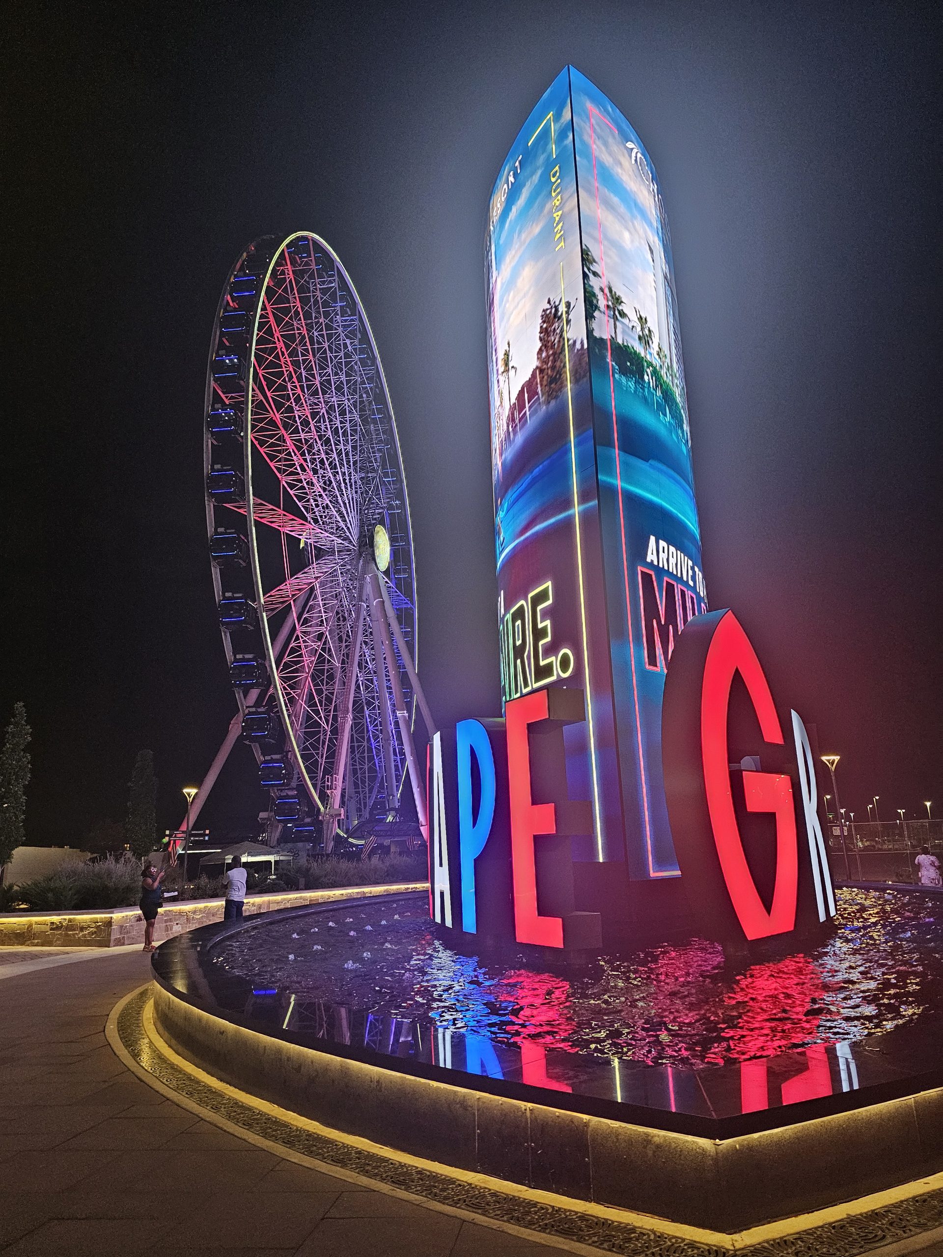 The Grandscape development in The Colony at night, with its illuminated Ferris wheel.