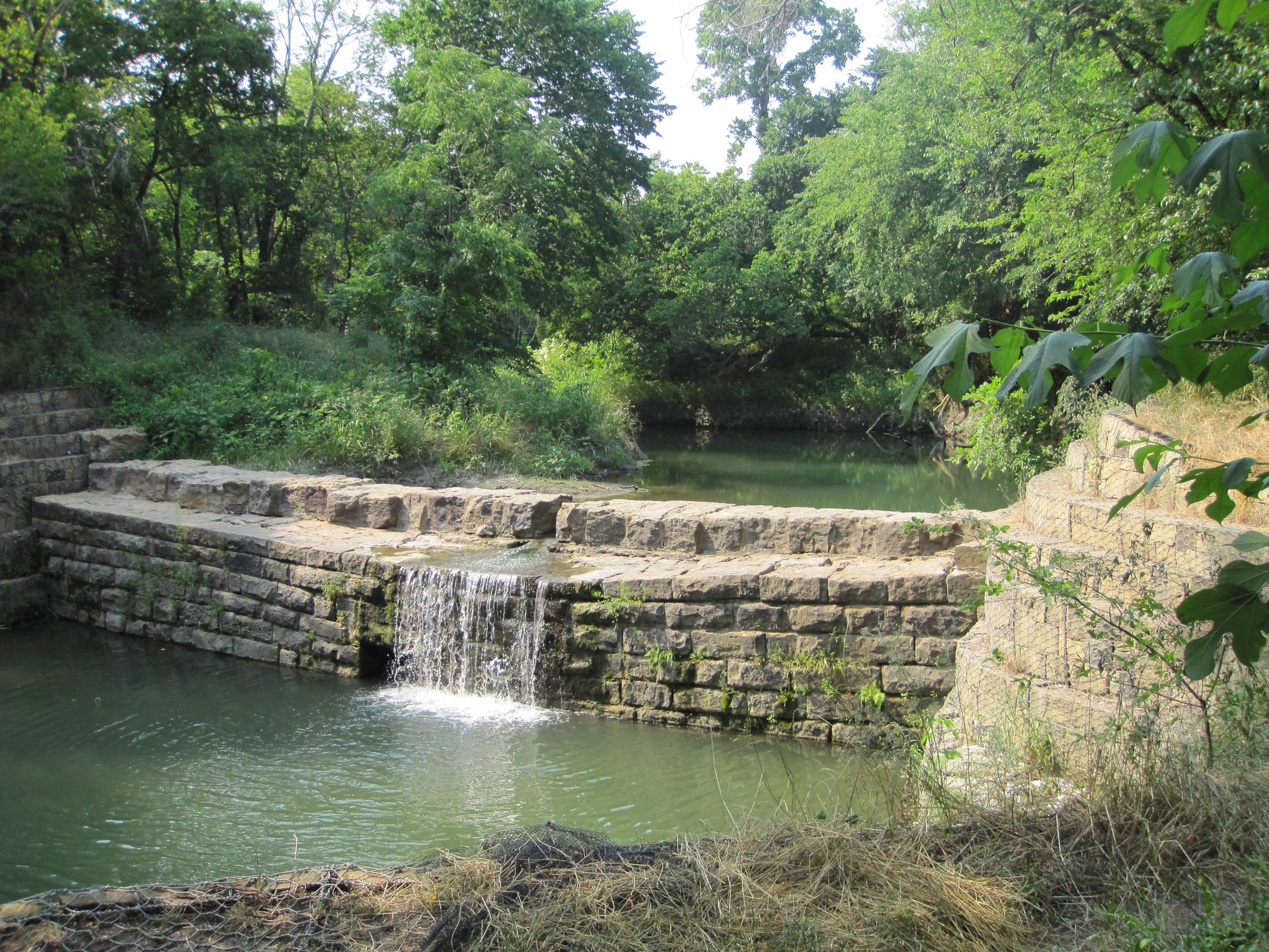 The stone dam and spillway at the historic Allen Water Station.